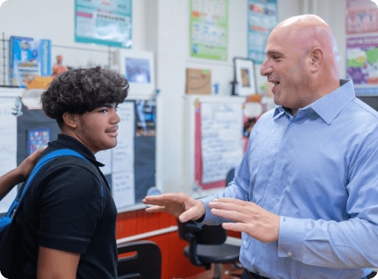 Liguori Academy - student and teacher talking